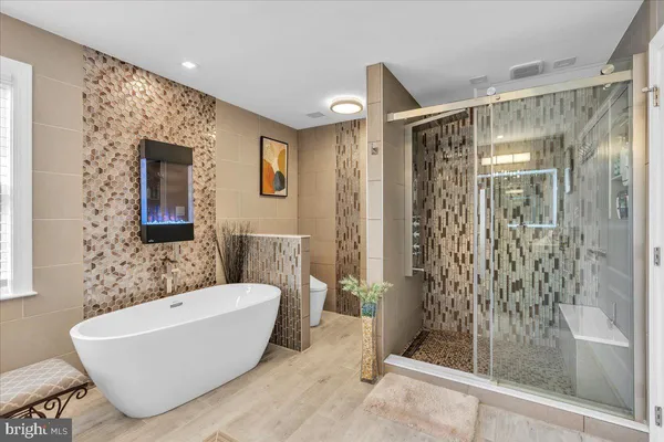 a bathroom with a bathtub and shower