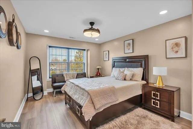 a bedroom with a bed and a table