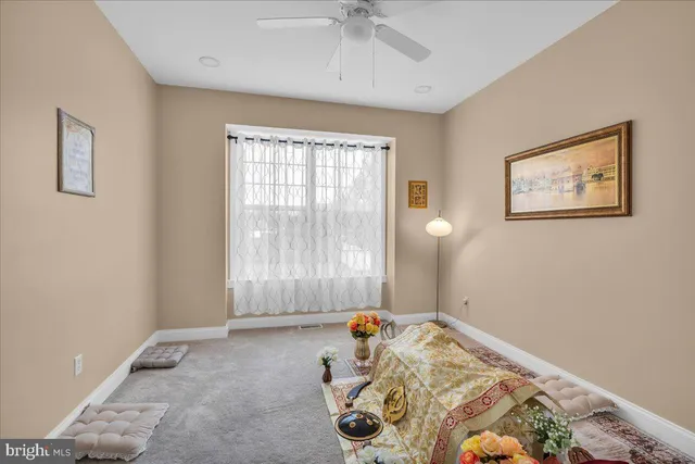 a bed room with a bed and a window