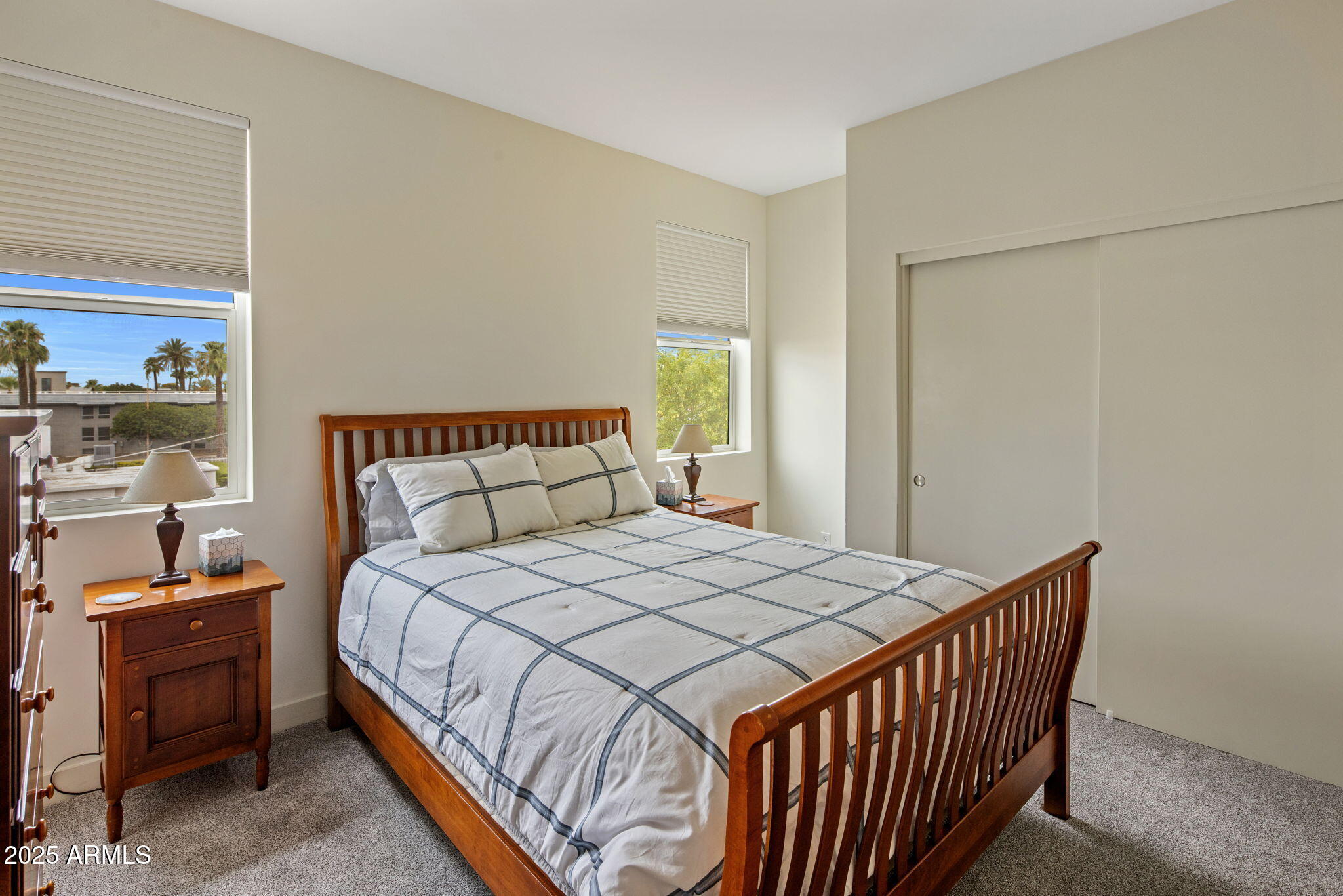 325 East Coronado Road, Unit 19 Phoenix, AZ 85004 - Photo 11 of 25 a bedroom with a bed and wooden floor