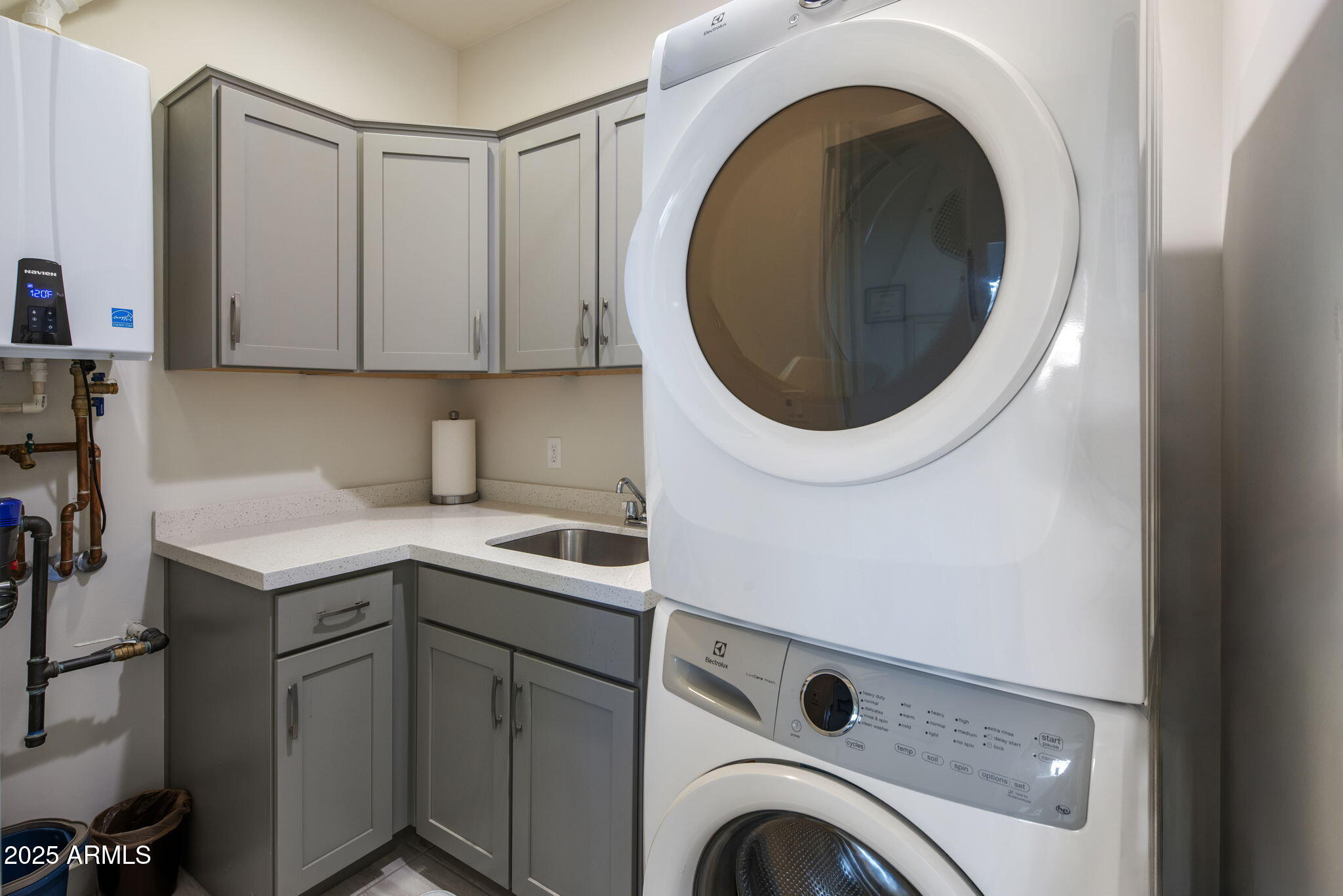 325 East Coronado Road, Unit 19 Phoenix, AZ 85004 - Photo 15 of 25 a kitchen with a sink and a washer dryer