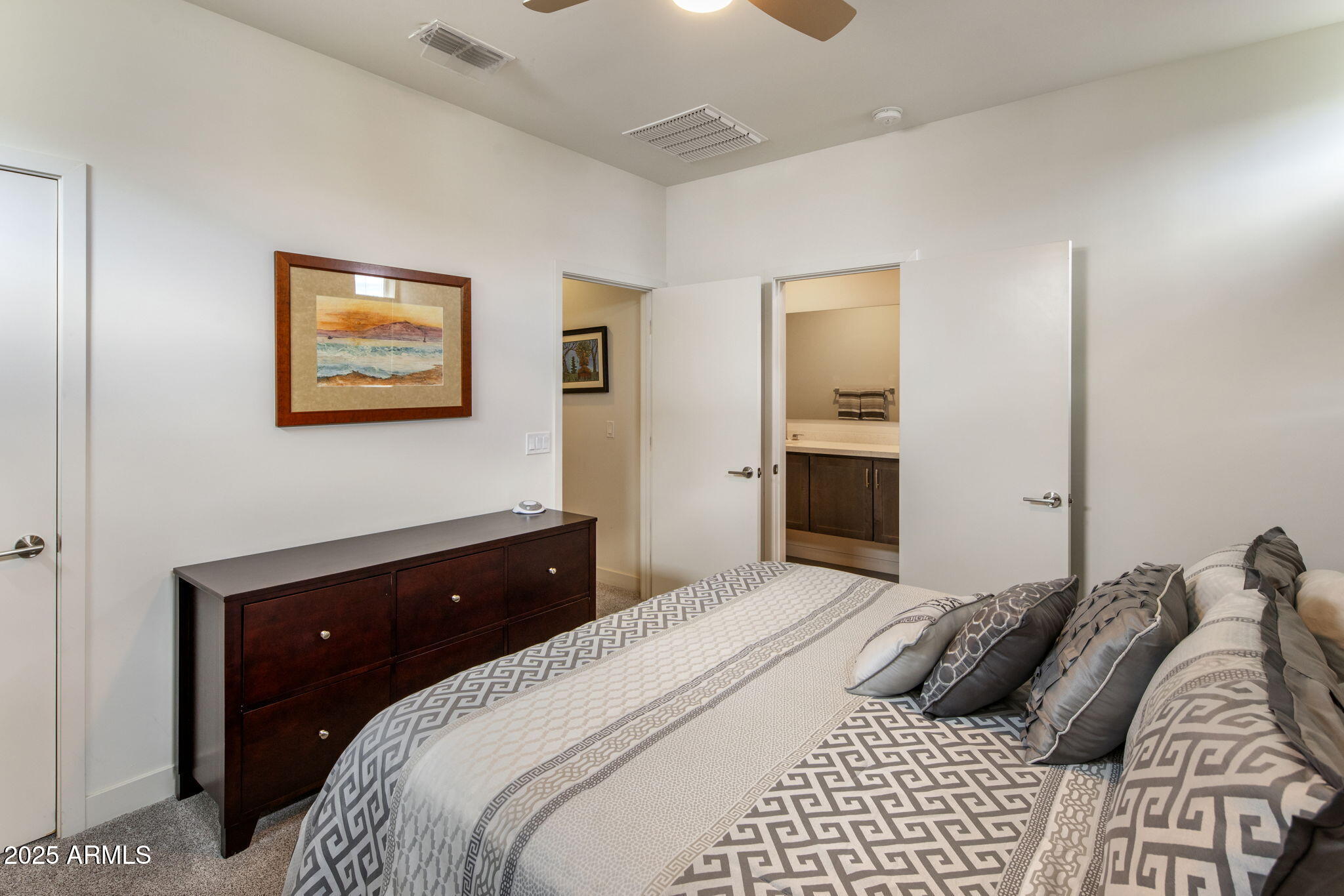 325 East Coronado Road, Unit 19 Phoenix, AZ 85004 - Photo 8 of 25 a bedroom with a bed and a painting on the wall
