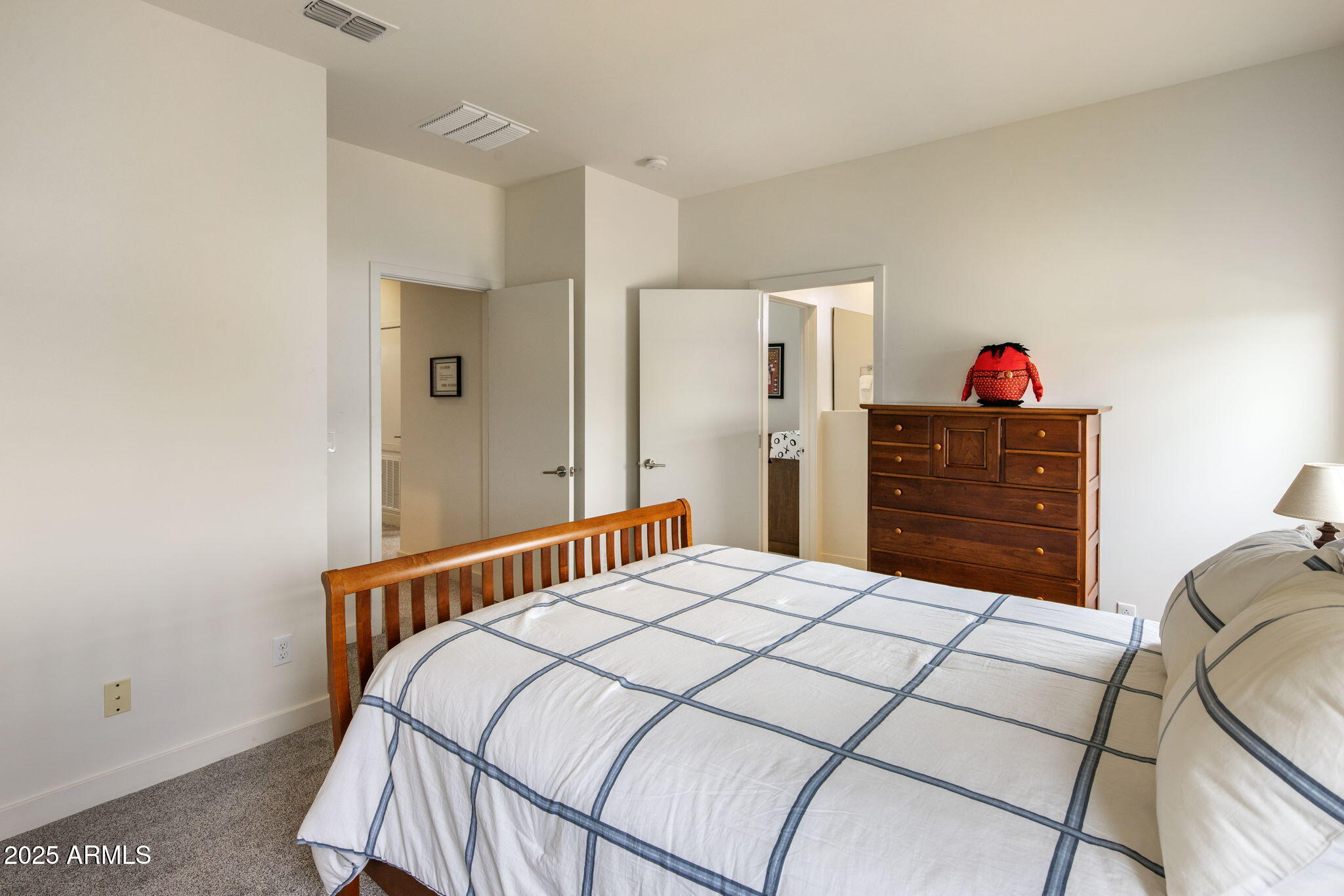 325 East Coronado Road, Unit 19 Phoenix, AZ 85004 - Photo 10 of 25 a bedroom with a bed and a closet