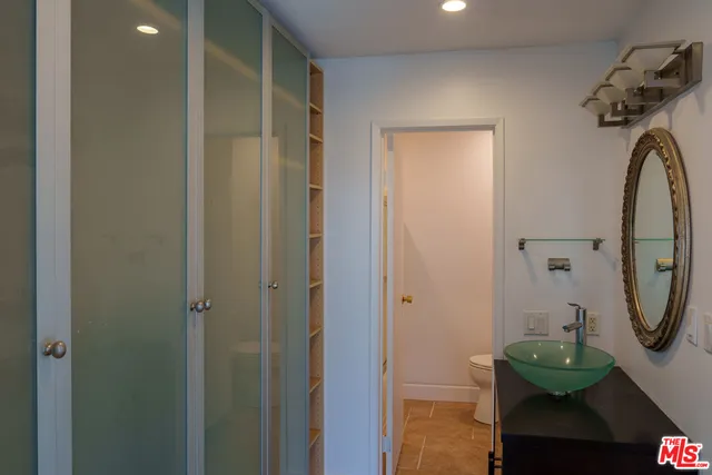 a bathroom with a sink and mirror