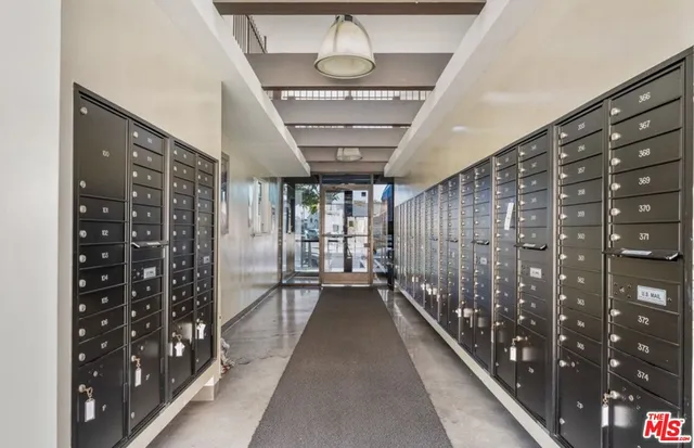 a living room with furniture a flat screen tv and a large window