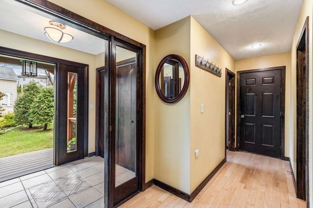 54 Acropolis Road Lowell, MA 01854 - Photo 4 of 35 a view of a hallway with a elevator