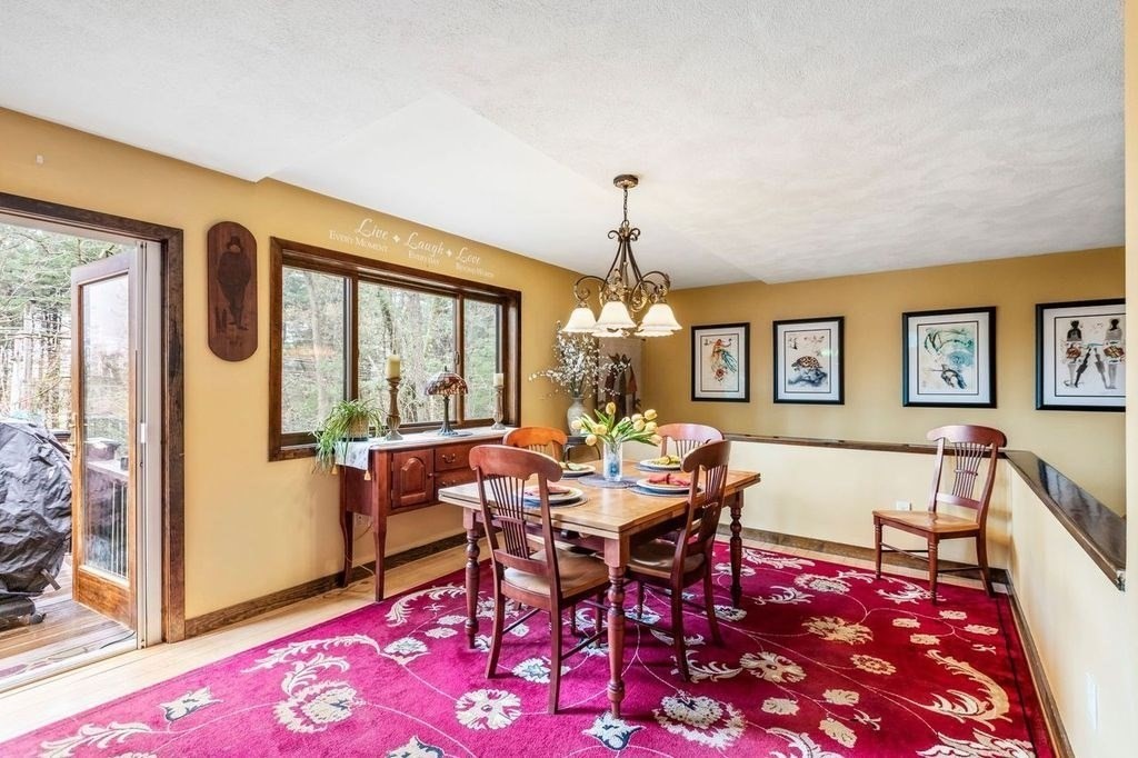 54 Acropolis Road Lowell, MA 01854 - Photo 7 of 35 a view of a dining room with furniture