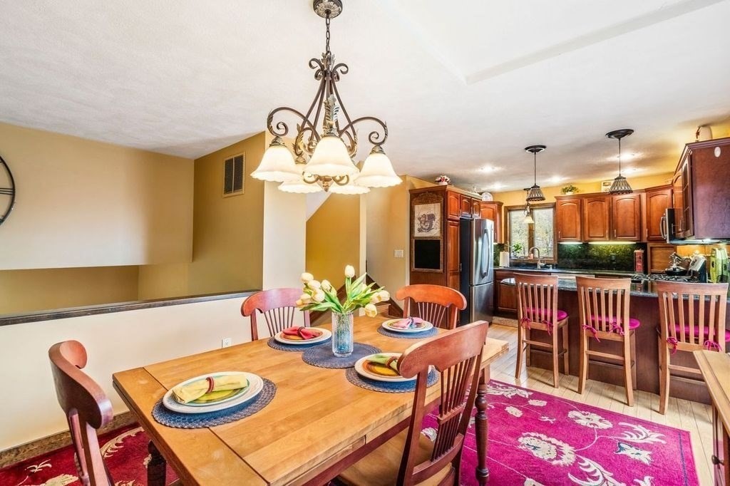 54 Acropolis Road Lowell, MA 01854 - Photo 8 of 35 a view of a dining room with furniture