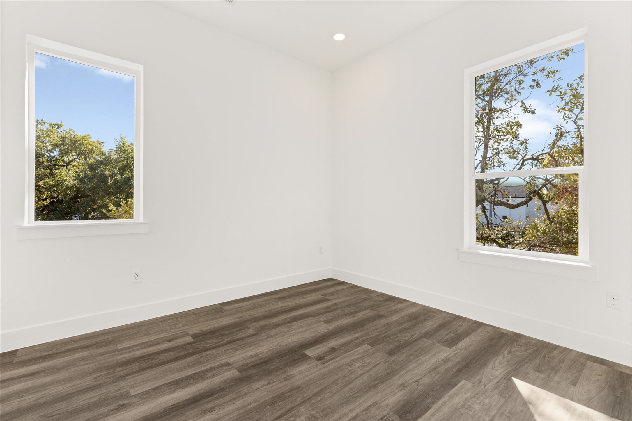 2709 Dennis Street Houston, TX 77004 - Photo 11 of 20 a view of a hallway with wooden floor and a workspace