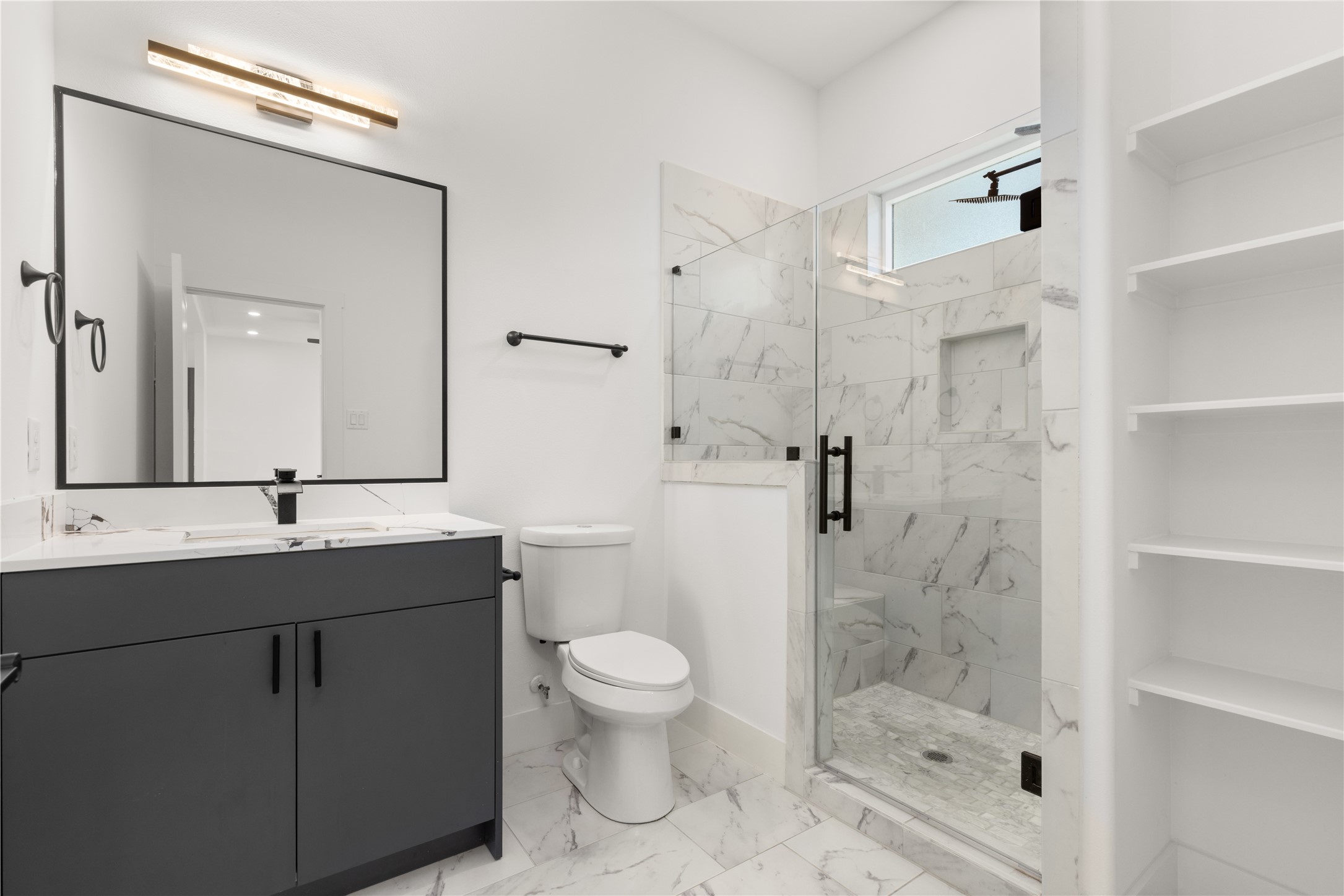 2709 Dennis Street Houston, TX 77004 - Photo 6 of 20 a bathroom with a sink a toilet and shower