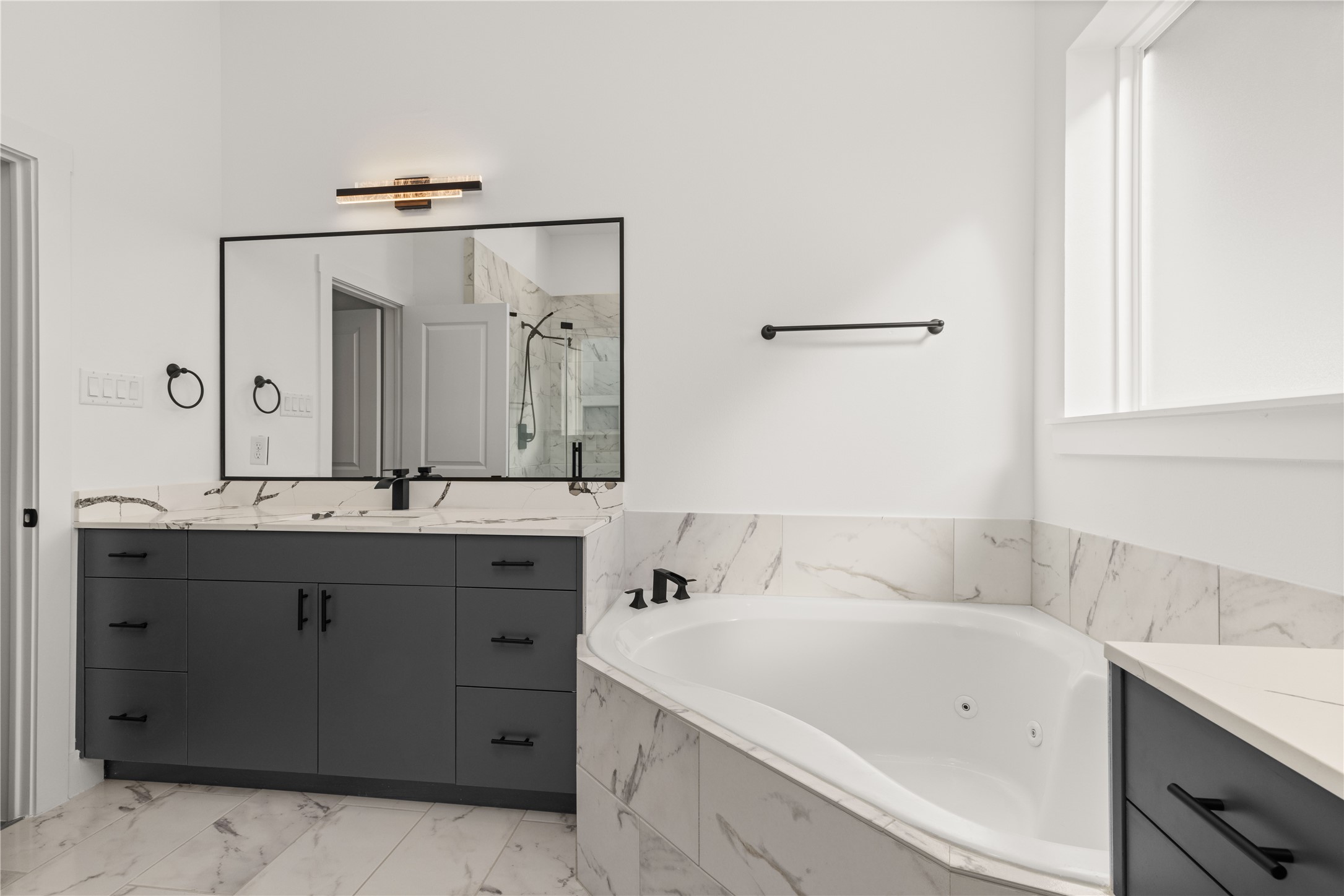 2709 Dennis Street Houston, TX 77004 - Photo 10 of 20 a bathroom with a bathtub sink and mirror