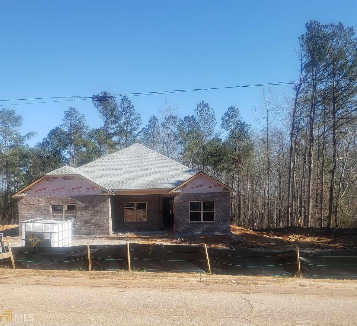 8348 East Carroll Road, Unit 1 Winston, GA 30187 - Photo 1 of 1 a front view of a house with a garden