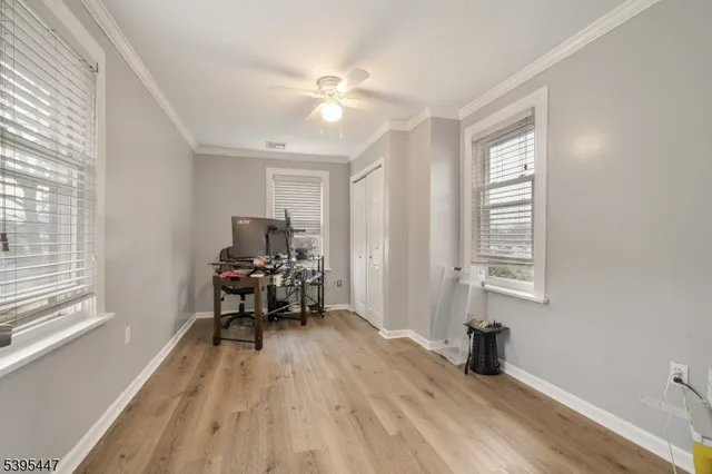 a bedroom with furniture and window