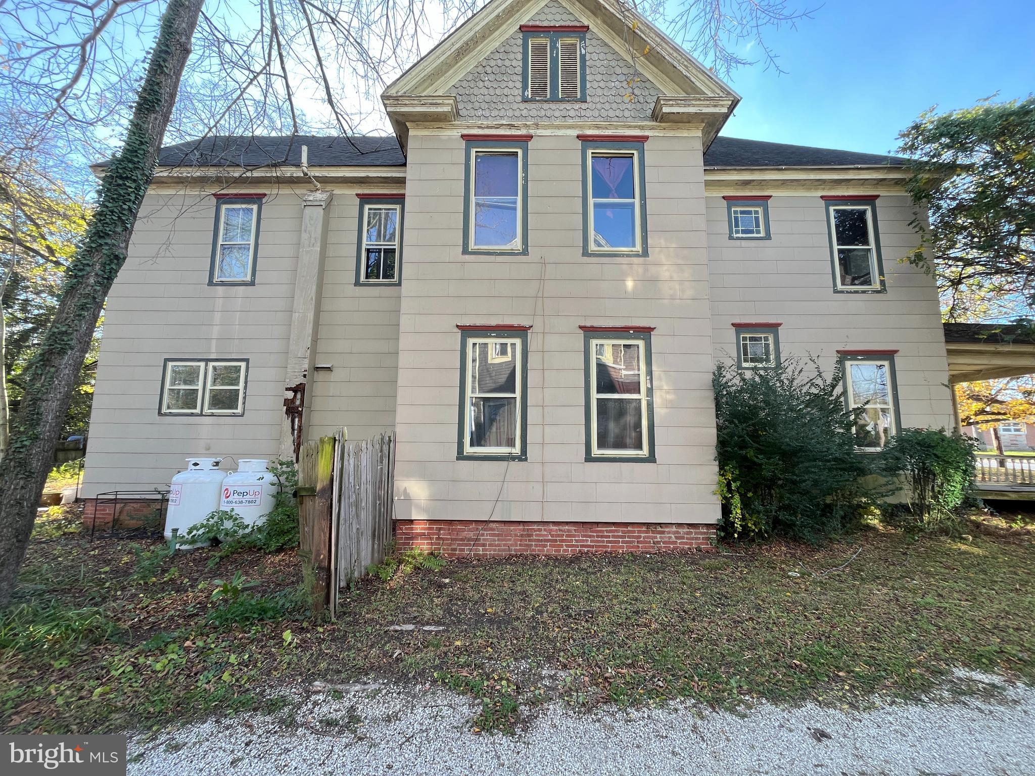 219 South Main Street Hurlock, MD 21643 - Photo 15 of 23 a front view of a house with garden