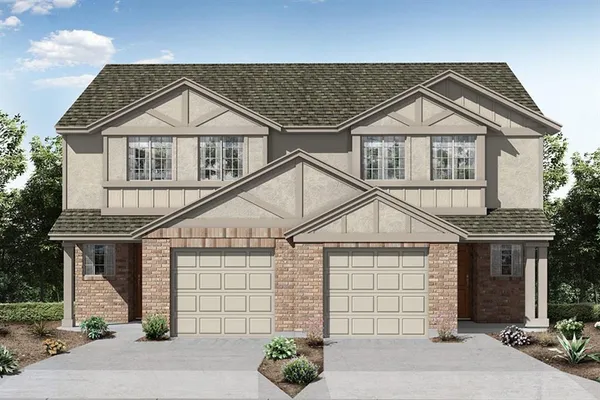 a view of a house with a yard and potted plants
