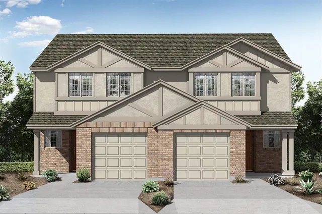 a view of a house with a yard and potted plants
