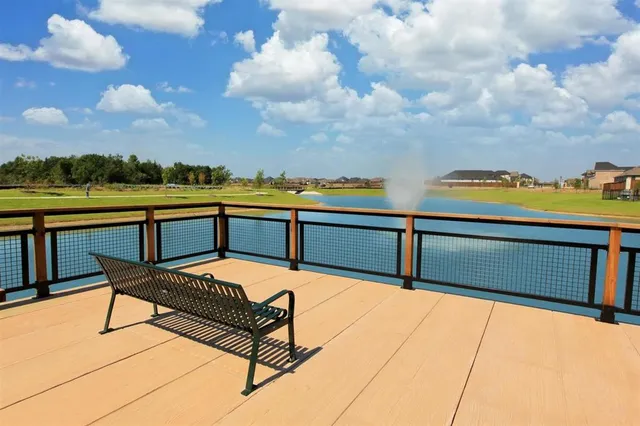 a view of swimming pool with outdoor seating
