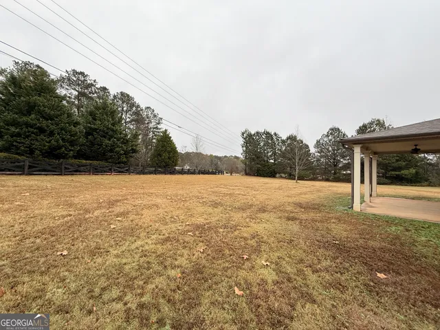 a view of open space with yard and mountain view in back