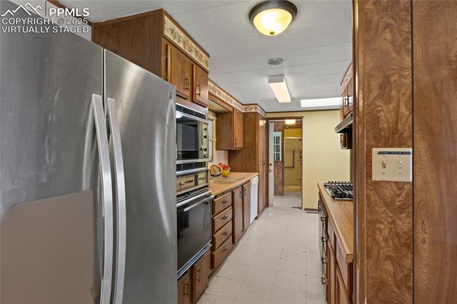 5505 Tamlin Road Colorado Springs, CO 80938 - Photo 6 of 15 “virtually staged”