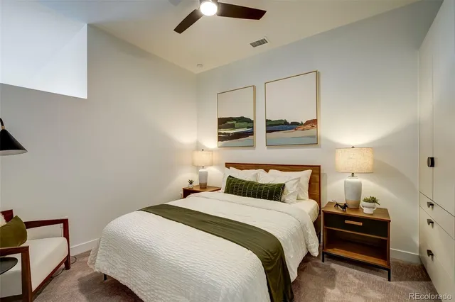 a bedroom with a bed and a mirror