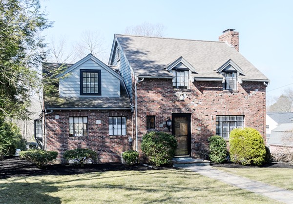 32 Sunset Road Wellesley, MA 02482 - Photo 1 of 23 a front view of a house with a yard and garage