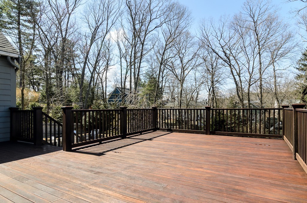 32 Sunset Road Wellesley, MA 02482 - Photo 17 of 23 a view of backyard with wooden deck and trees
