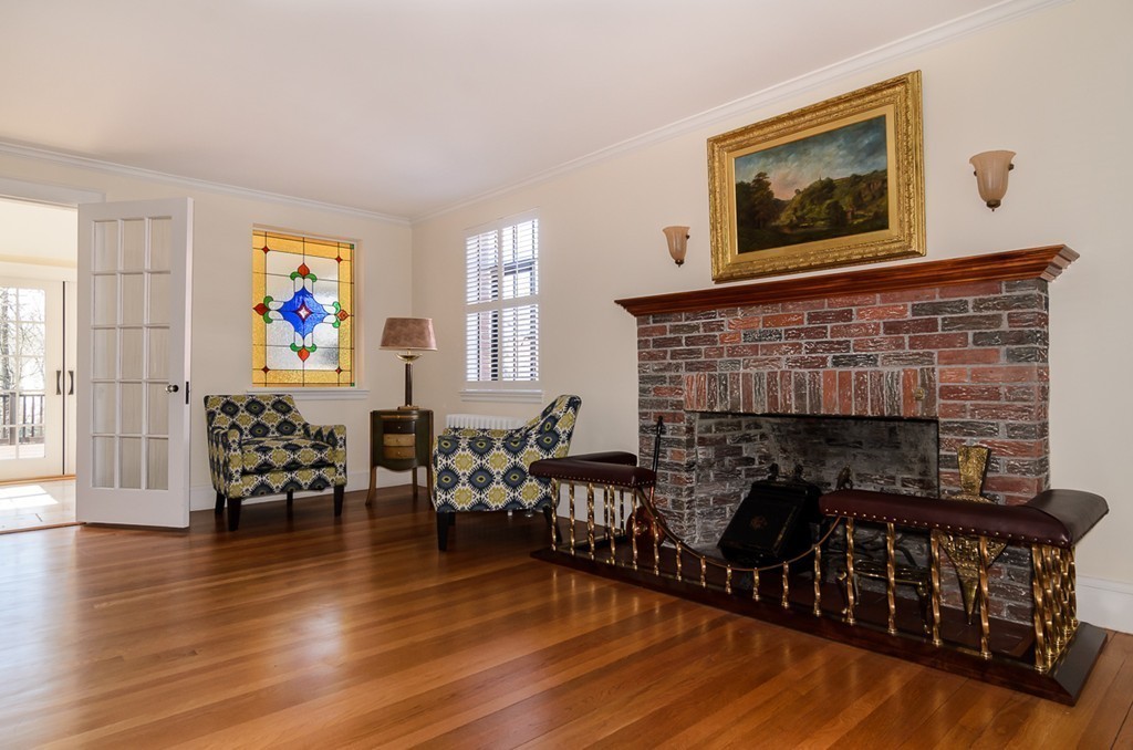 32 Sunset Road Wellesley, MA 02482 - Photo 3 of 23 a living room with furniture and a fireplace