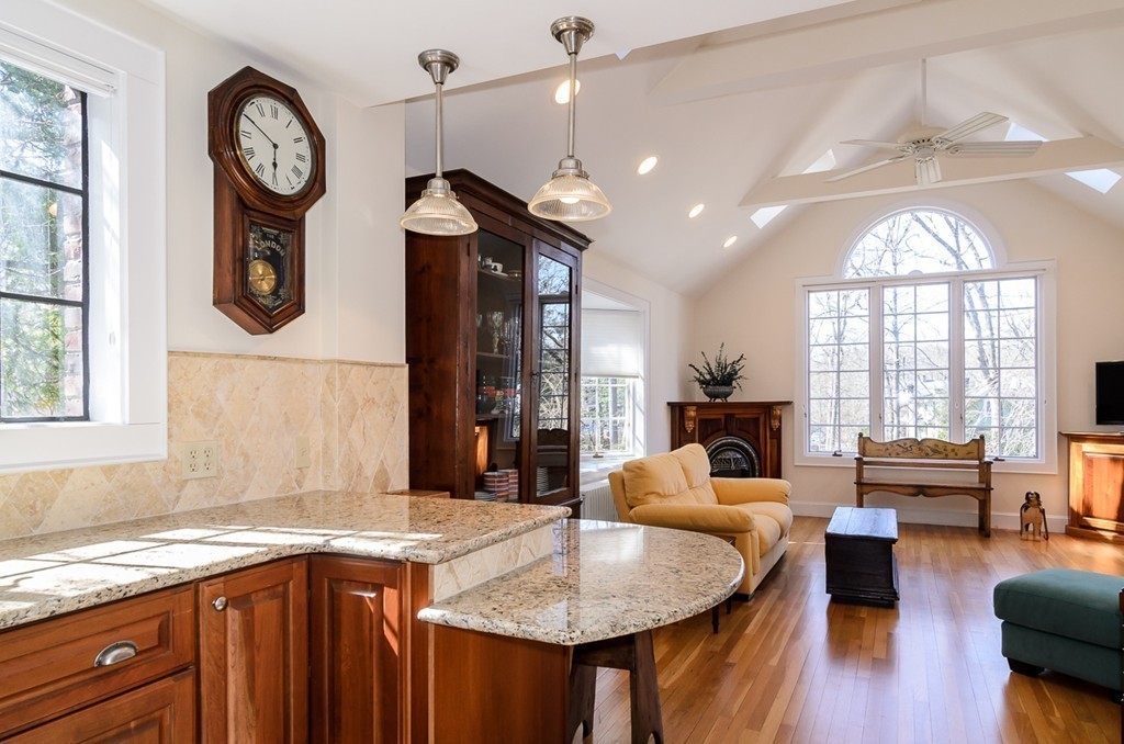 32 Sunset Road Wellesley, MA 02482 - Photo 8 of 23 a hall with kitchen island granite countertop a large window and a view of living room