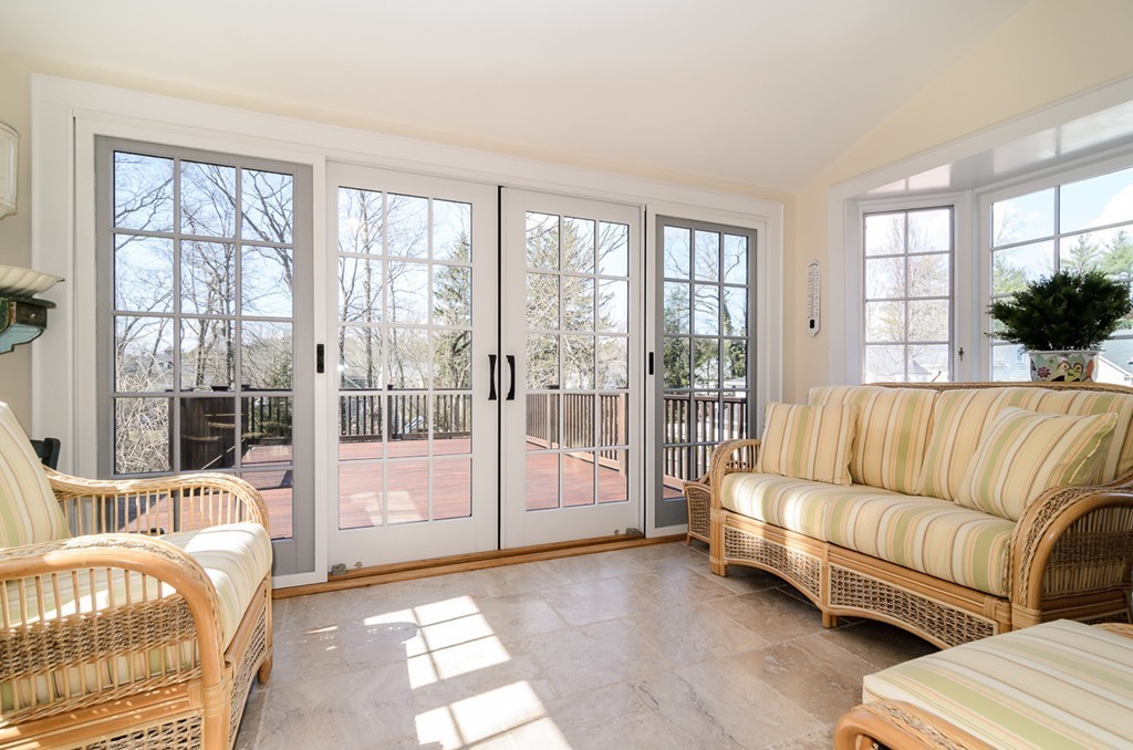 32 Sunset Road Wellesley, MA 02482 - Photo 10 of 23 a living room with furniture and a floor to ceiling window