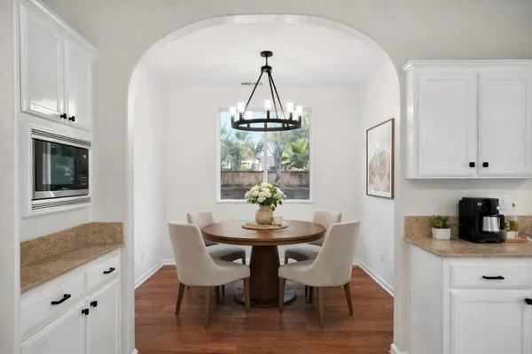 a view of a room with wooden floor