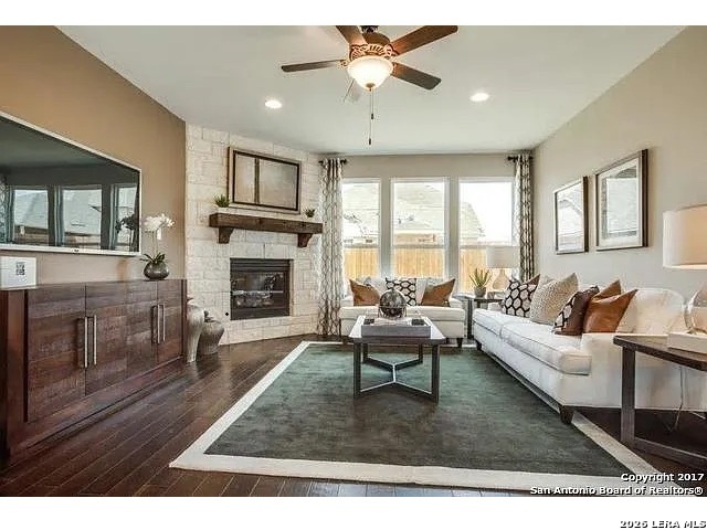 119 Aberdeen Boerne, TX 78015 - Photo 6 of 10 a living room with furniture a window and a fireplace