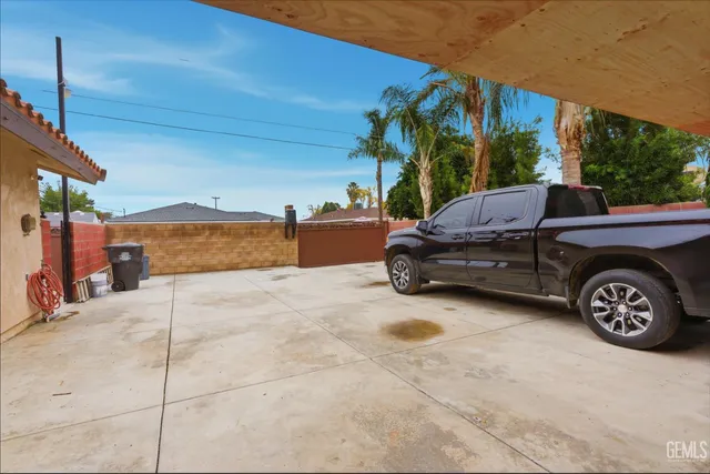 a view of a car parked in back of a house