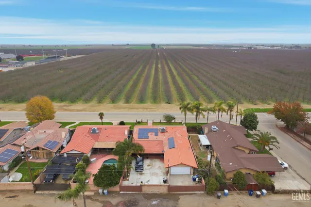an aerial view of a house with outdoor space