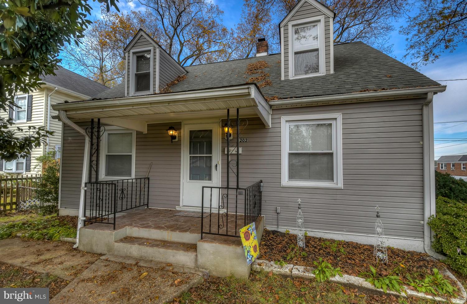 4202 Belle Grove Road Baltimore, MD 21225 - Photo 1 of 31 a front view of a house with garden
