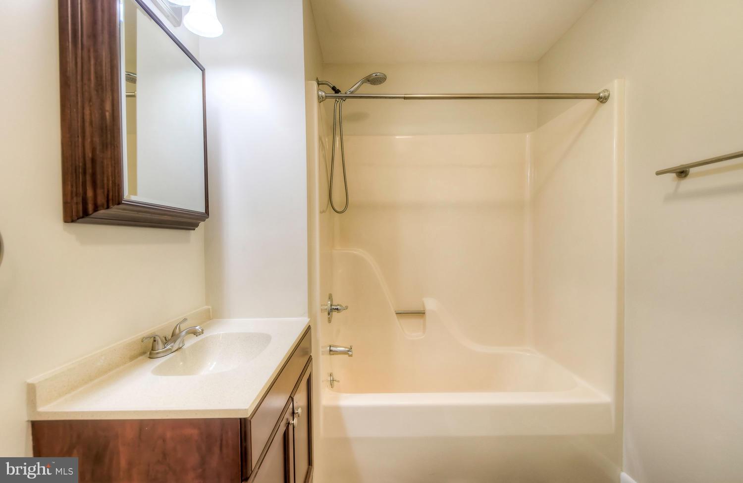 4202 Belle Grove Road Baltimore, MD 21225 - Photo 16 of 31 a bathroom with a tub and a sink