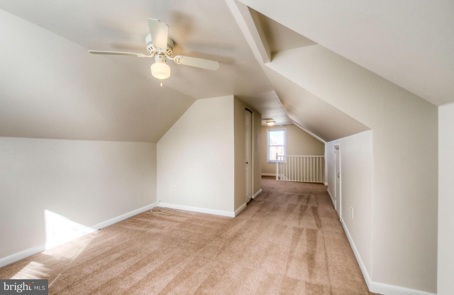 4202 Belle Grove Road Baltimore, MD 21225 - Photo 19 of 31 a view of a hallway with a chandelier
