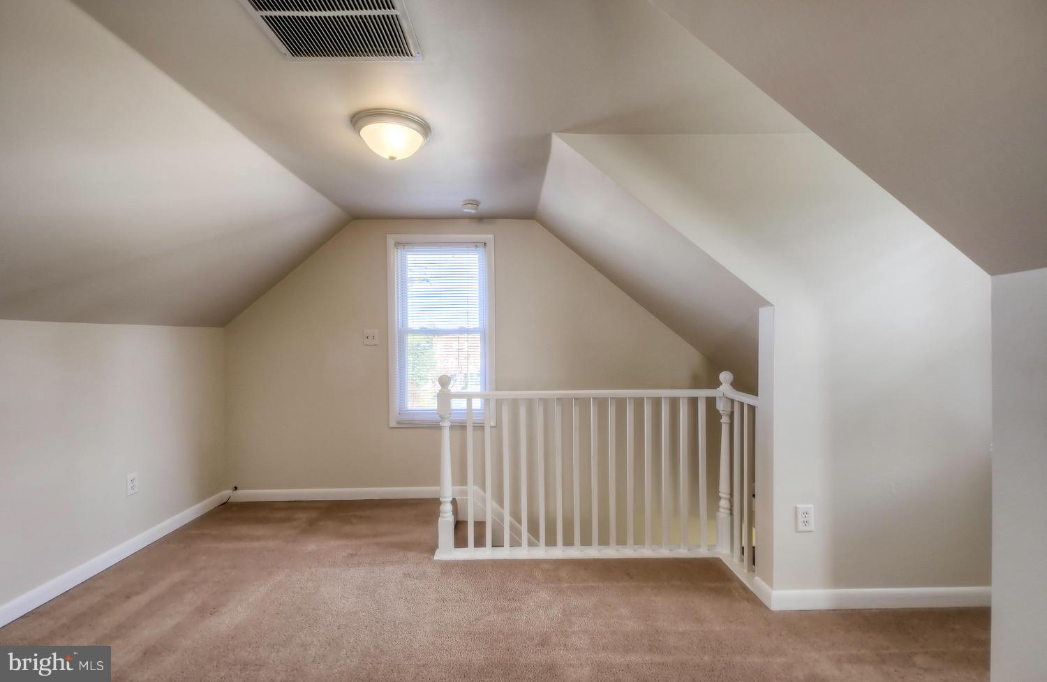 4202 Belle Grove Road Baltimore, MD 21225 - Photo 20 of 31 an empty room with windows and stairs