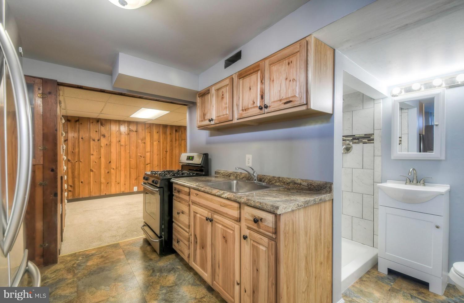 4202 Belle Grove Road Baltimore, MD 21225 - Photo 24 of 31 a kitchen that has a cabinets and a stove