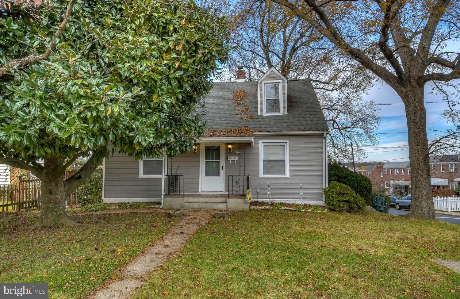 4202 Belle Grove Road Baltimore, MD 21225 - Photo 4 of 31 a front view of house with yard and trees around