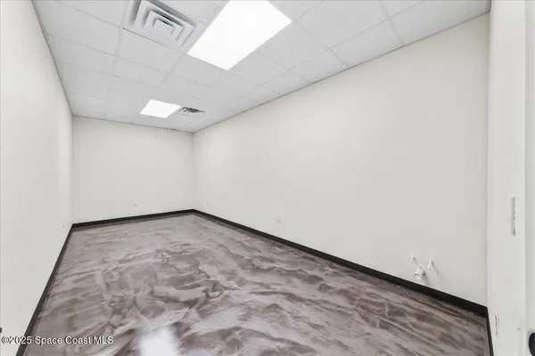 an empty room with a bench