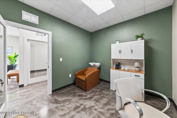 a room with furniture and a chair