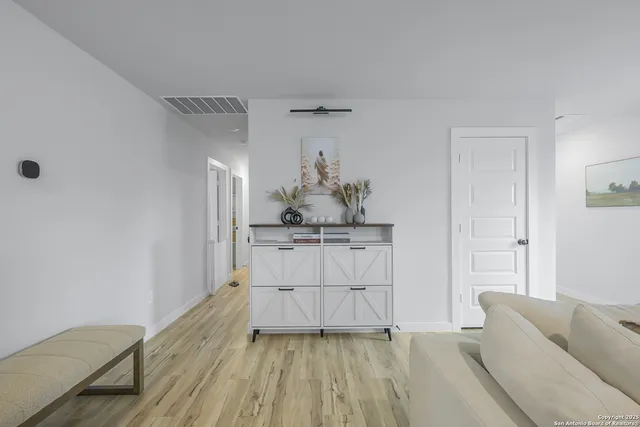 a view of kitchen with furniture and wooden floor