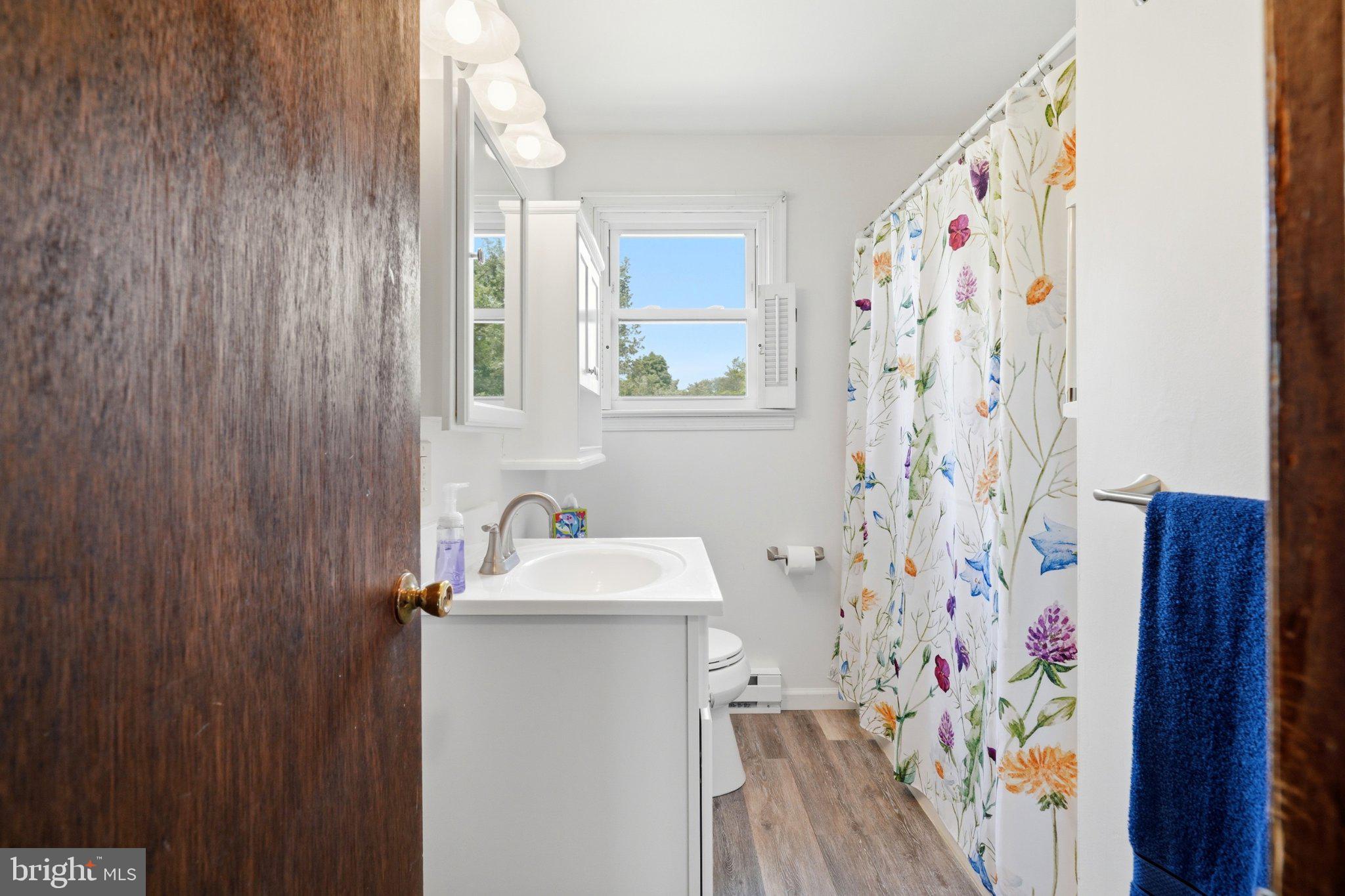 1385 Woodmere Road Pottstown, PA 19464 - Photo 37 of 63 Bright and airy floral bathroom retreat.