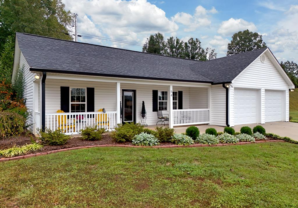 54 Linda Lane Blue Ridge, GA 30513 - Photo 1 of 59 a front view of a house with garden