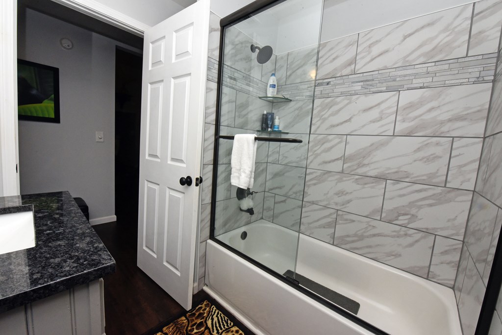 54 Linda Lane Blue Ridge, GA 30513 - Photo 23 of 59 a bathroom with a granite countertop bathtub shower and sink