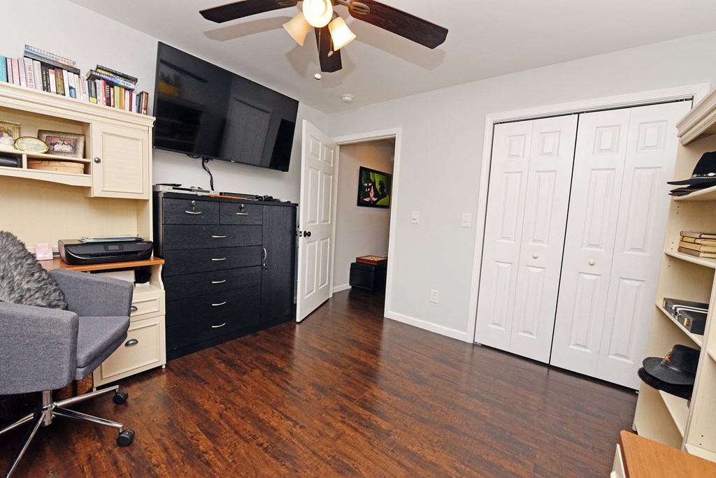 54 Linda Lane Blue Ridge, GA 30513 - Photo 34 of 59 a room with a flat screen tv and a ceiling fan