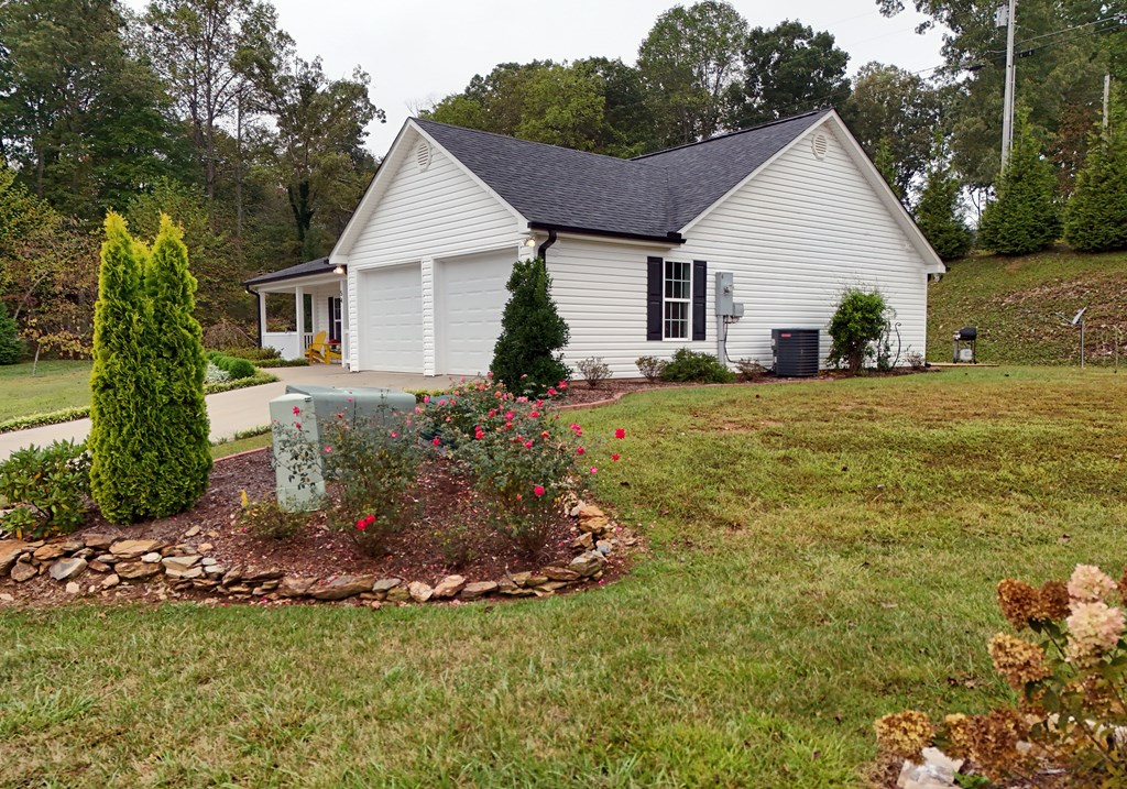 54 Linda Lane Blue Ridge, GA 30513 - Photo 55 of 59 a view of a house with a yard and potted plants