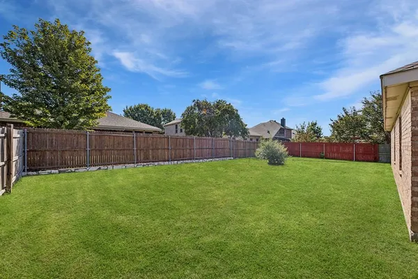 a view of a backyard with green space