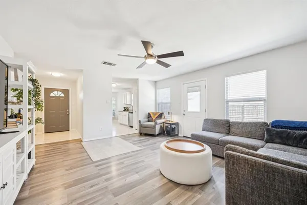 a living room with furniture and a large window