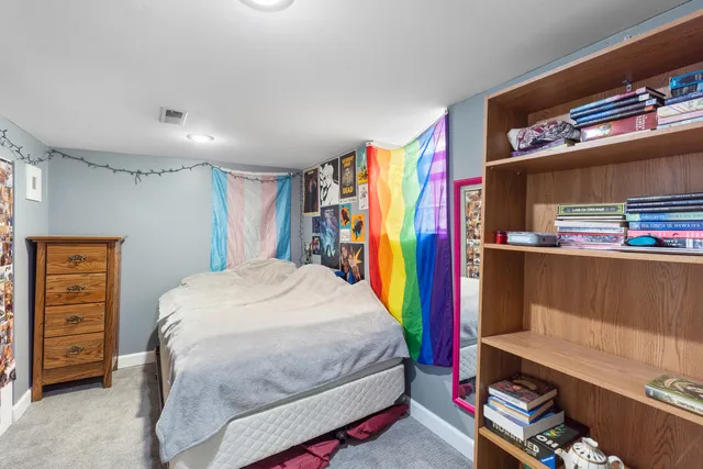 a bed room with a bed furniture and a window